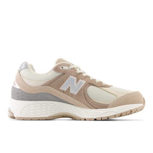 New Balance 2002R Sneakers in Driftwood with Sandstone and Moonbeam. These sneakers feature a retro-inspired design with a premium suede and mesh upper and a cushioned midsole for comfort.